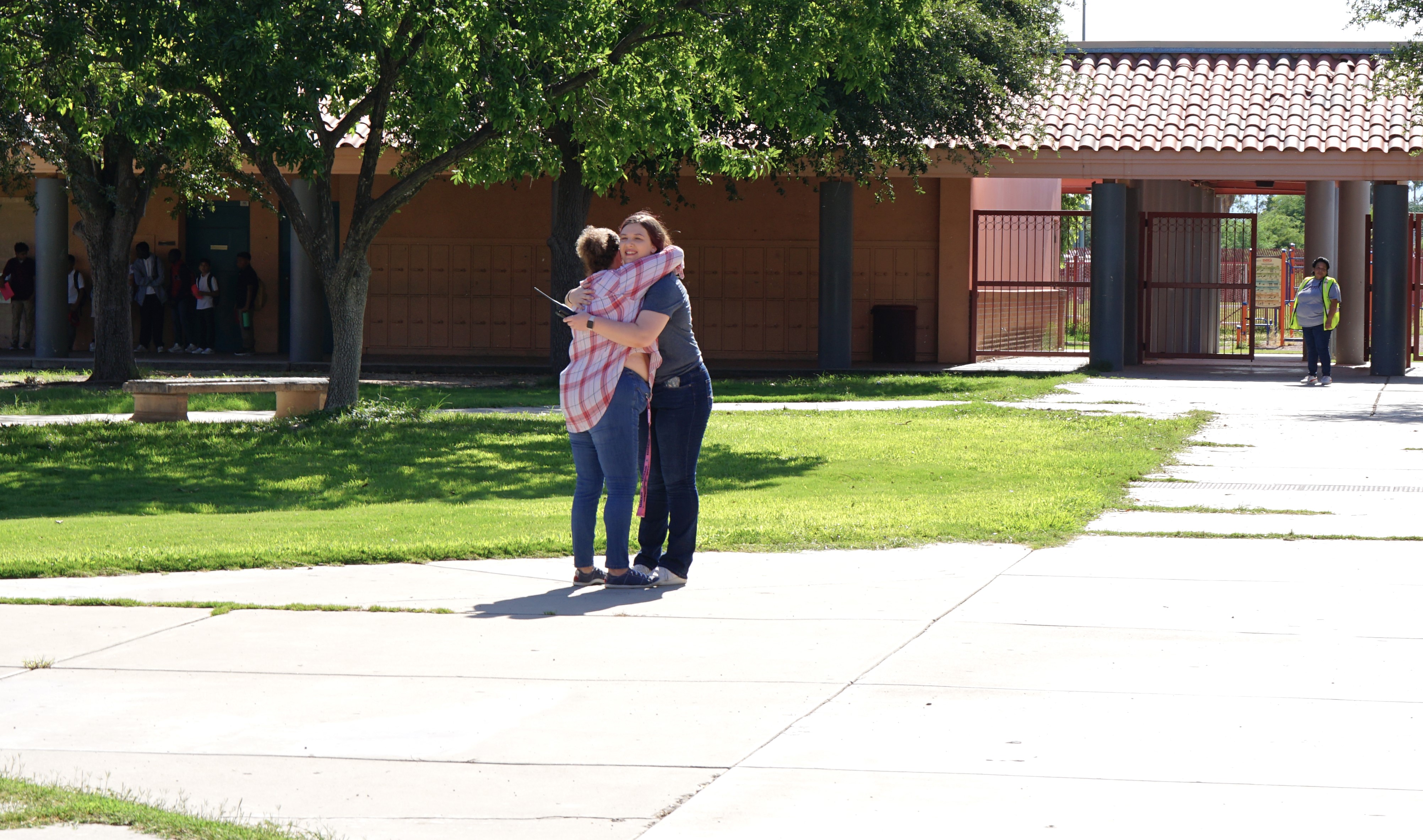 A mom and daughter hug outside Doolen on the first day