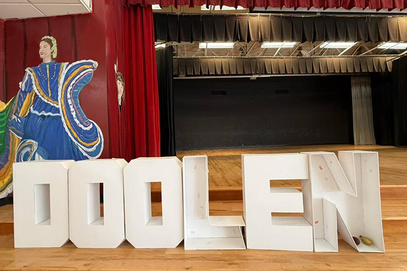 Giant letters spelling out Doolen in front of the stage
