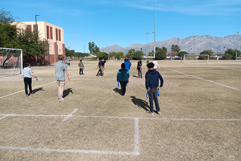 Students play outside on the field
