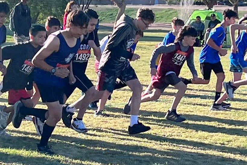 A group of boys take off running at the start of the race